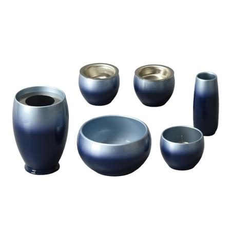 Japanese-made stainless steel blue Buddhist altar set, including a vase, flower vase, candle holder, incense burner, rice bowl, teacup, and incense holder. 