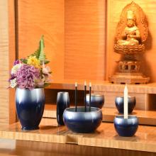 Japanese-made stainless steel blue Buddhist altar set, including a vase, flower vase, candle holder, incense burner, rice bowl, teacup, and incense holder. 