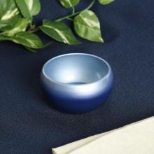 Japanese-made stainless steel blue Buddhist altar set, including a vase, flower vase, candle holder, incense burner, rice bowl, teacup, and incense holder. 